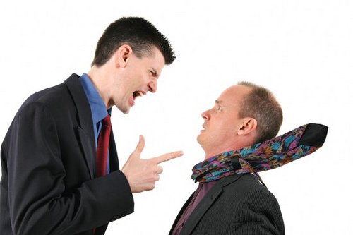 Man yelling and pointing at another man