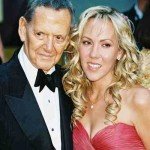 Tony Randell in a tuxedo and his wife in a pink strapless dress