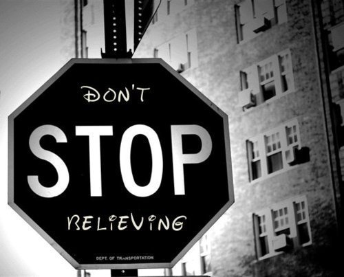 Black and white image of stop sign reads Don't STOP Believing