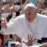 Pope Francis poses for pictures with thumbs up