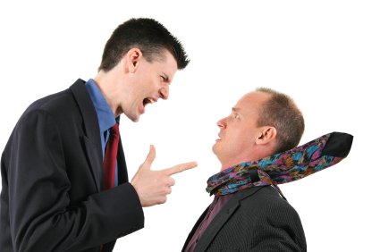 Man points finger at another man while yelling