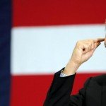 John Kasich points to head during speech