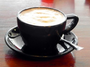 latte in a black coffee cup