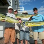 men-holding-mahi.jpg
