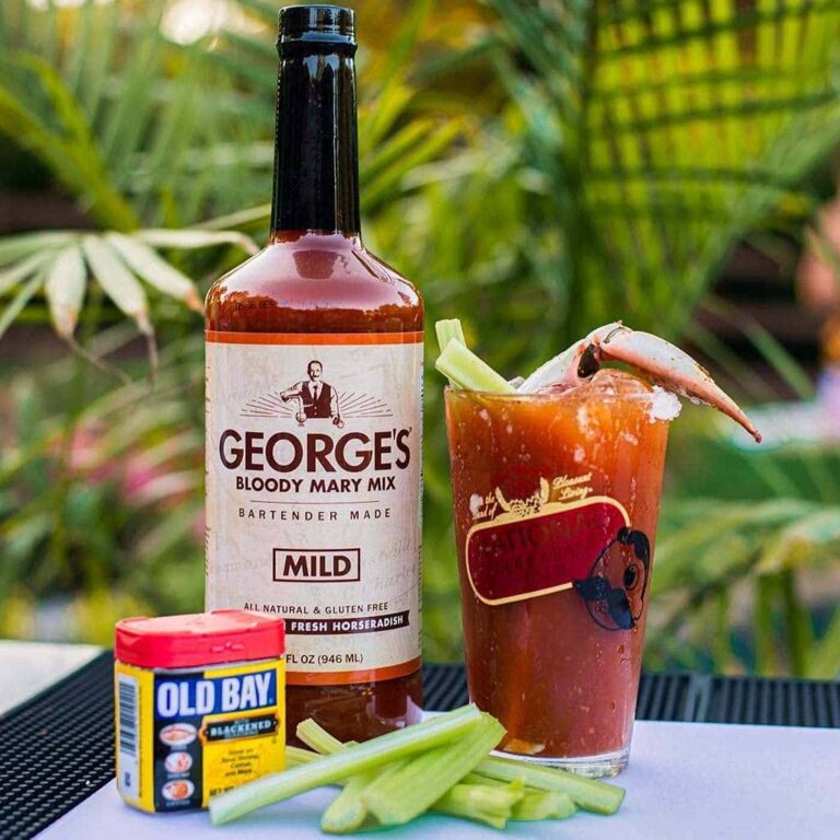 GEORGE’S® Mild Bloody Mary mix bottle with OLD BAY®, Bloody Mary in Natty Boh glass, and celery sticks