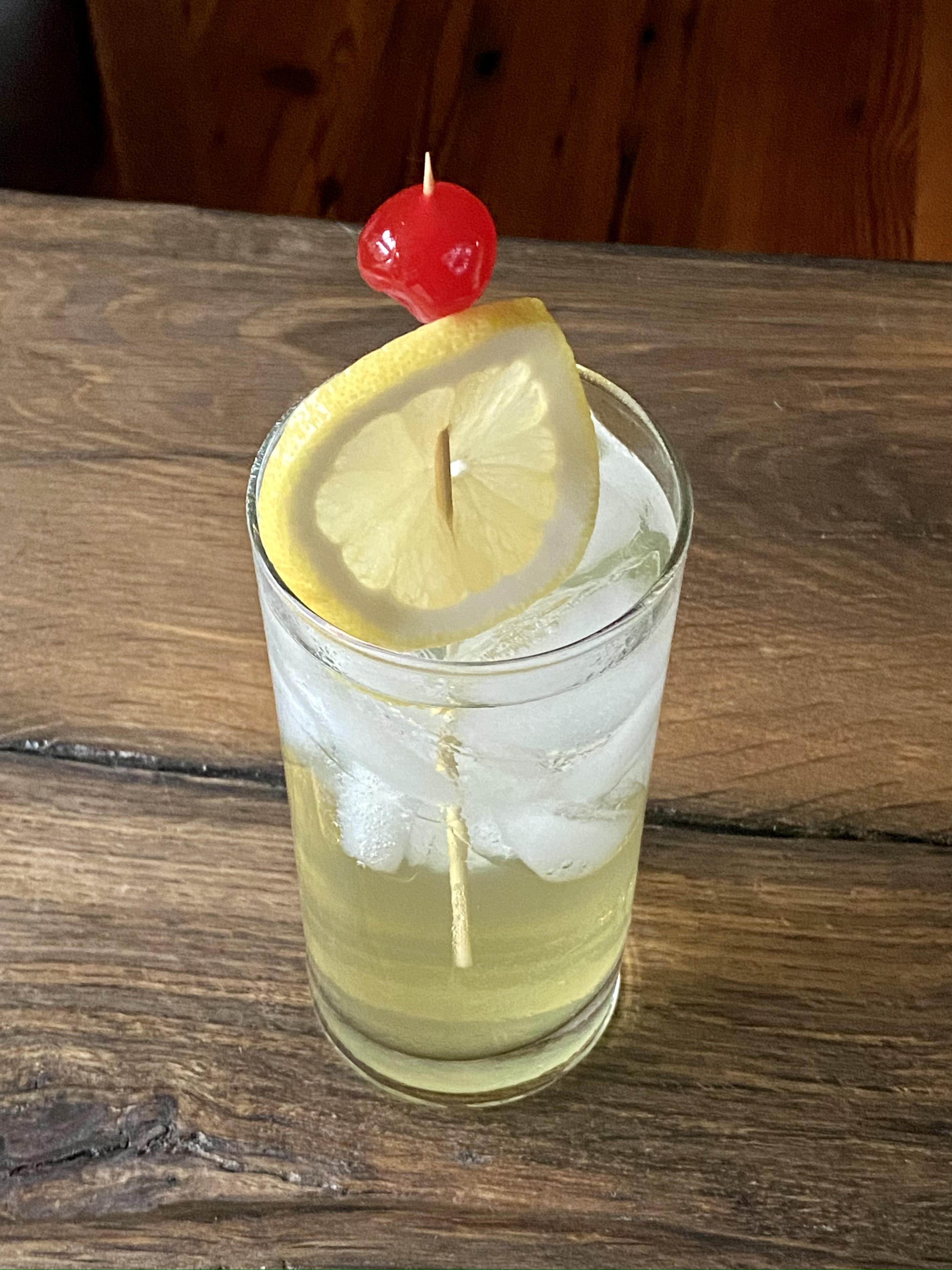 cocktail with lemon and cherry