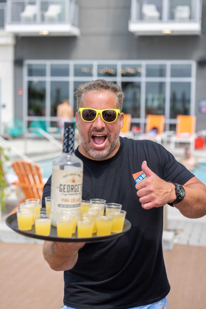 guy holding tray of Pina Colada shots