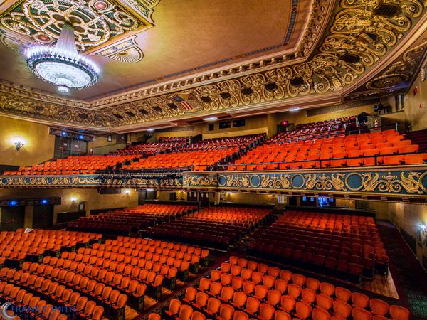 ornately decorated theater balcony and seating area