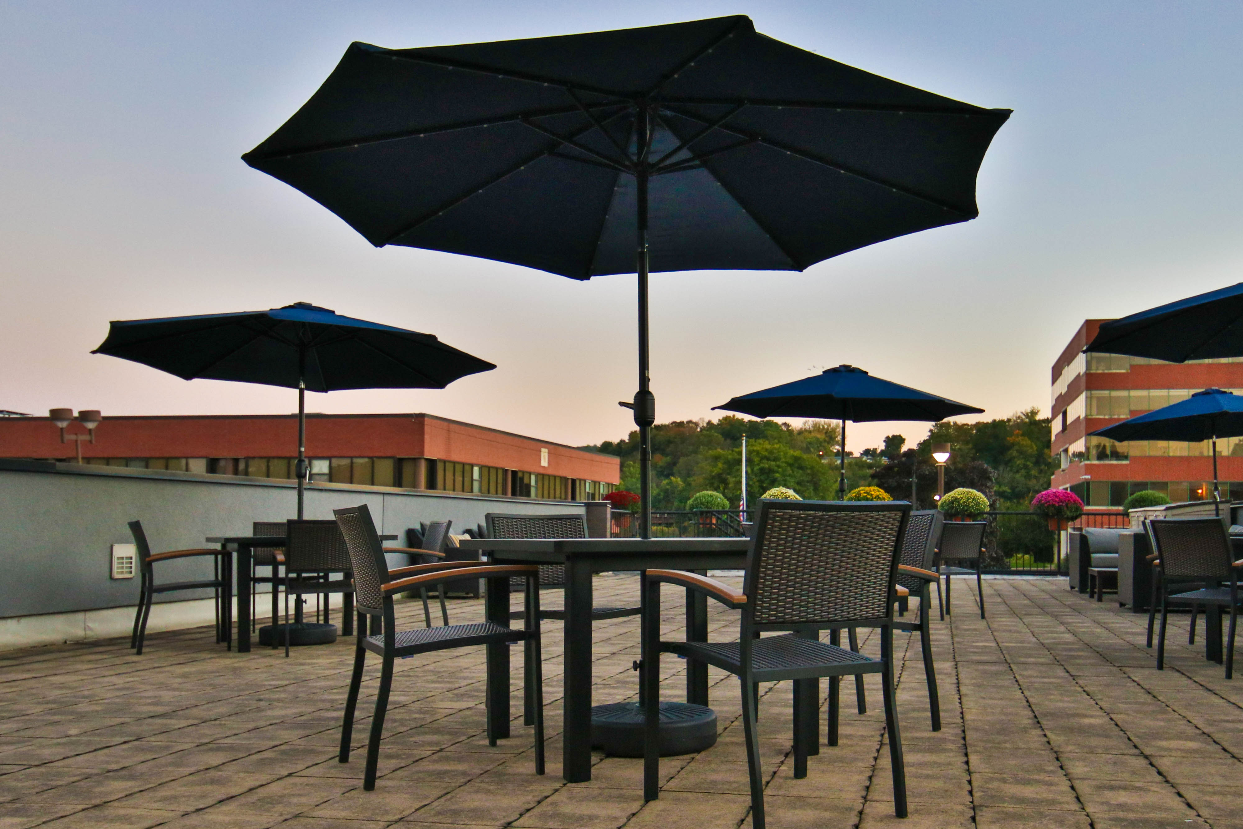 outdoor terrace with tables with umbrellas, and chairs