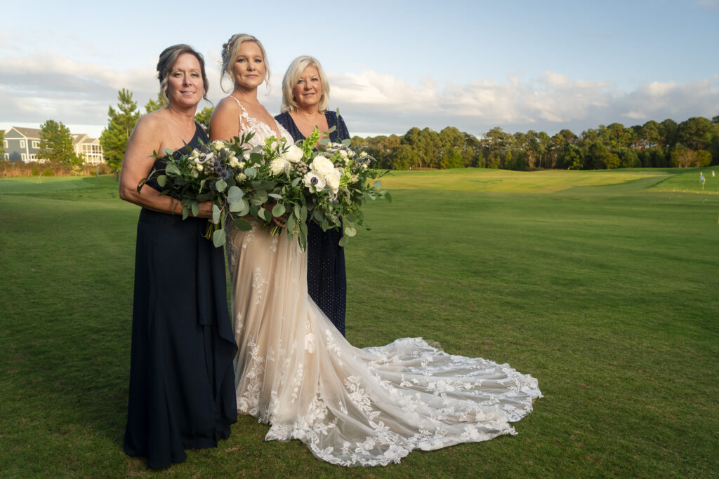 a bride and her bridesmaids posing for a picture