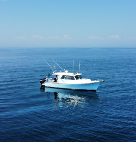 Chasin' Tides Charters boat in the middle of the ocean miles offshore