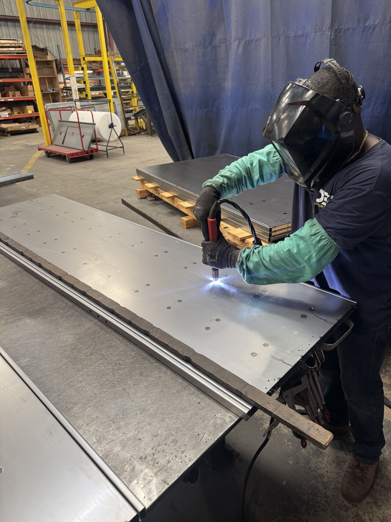 a man working on a piece of metal