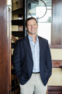 a man in a suit standing in a doorway