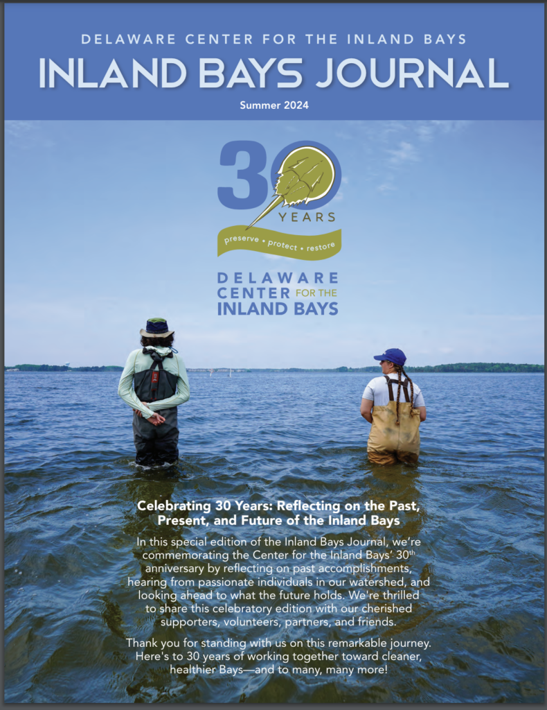 a magazine cover with two men standing in the water