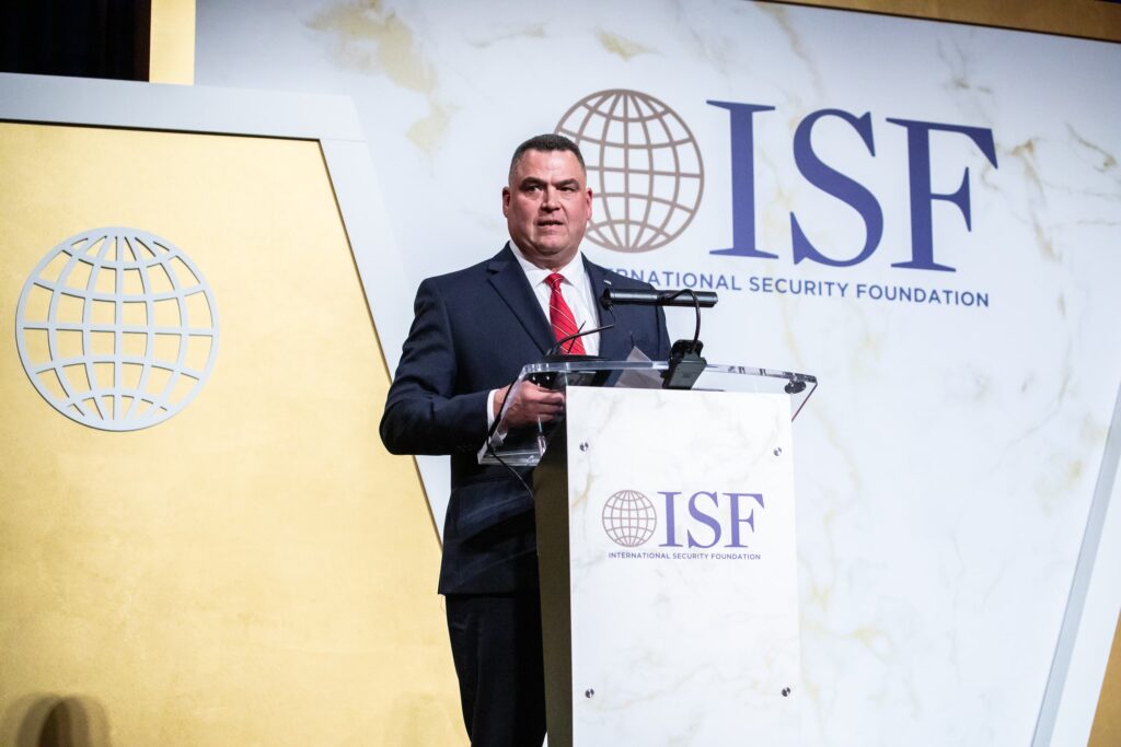 a man standing at a podium giving a speech