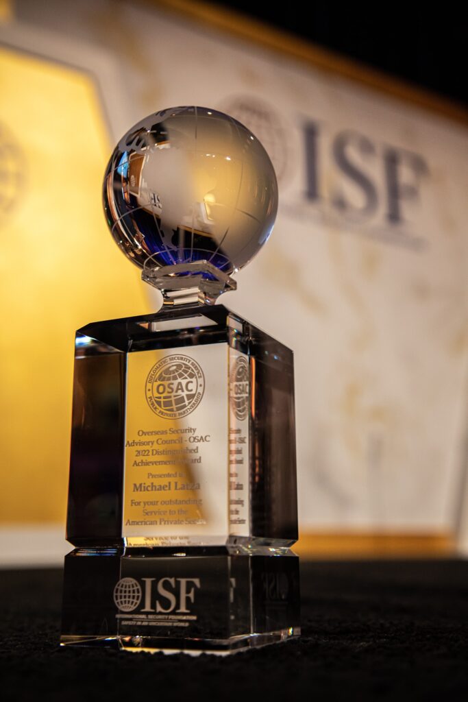 a glass award sitting on top of a table