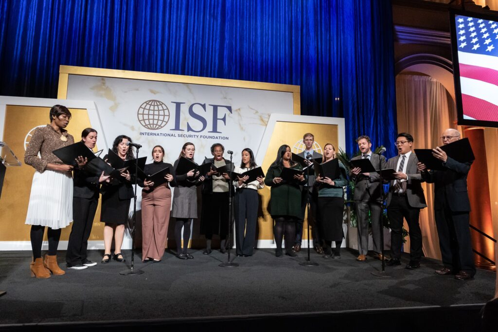 a group of people standing on top of a stage