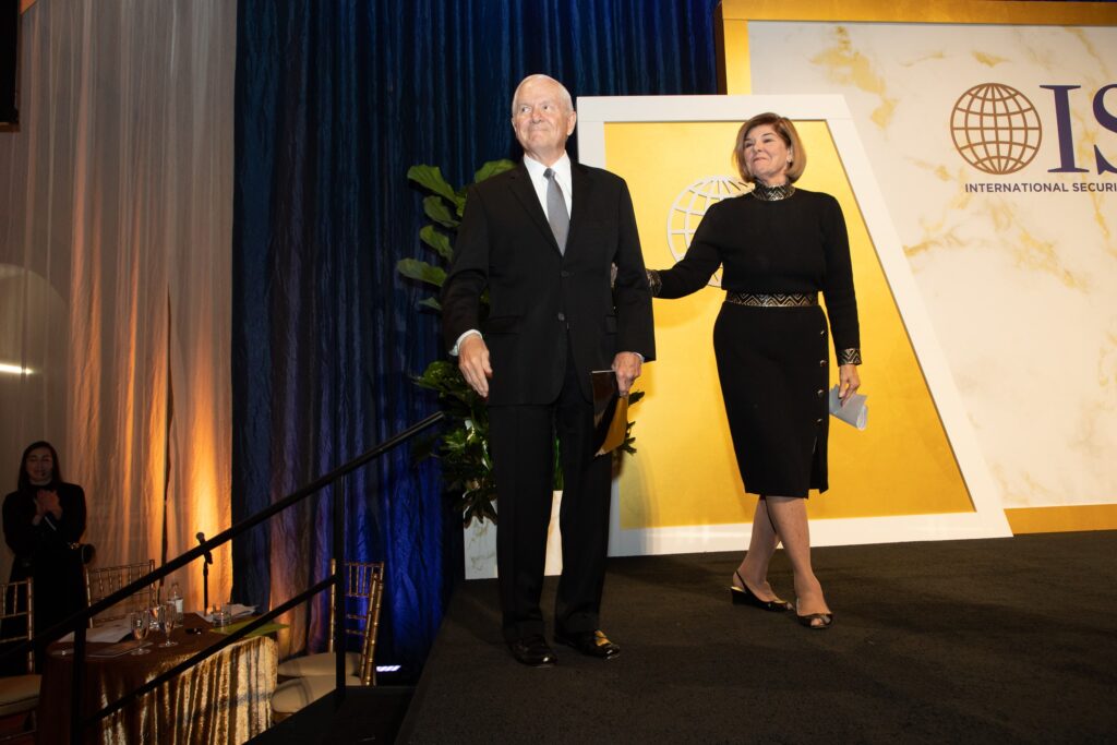 a man and woman shaking hands on stage