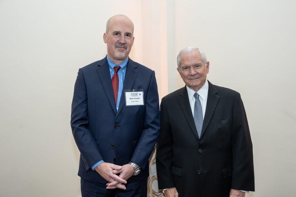 two men in suits standing next to each other