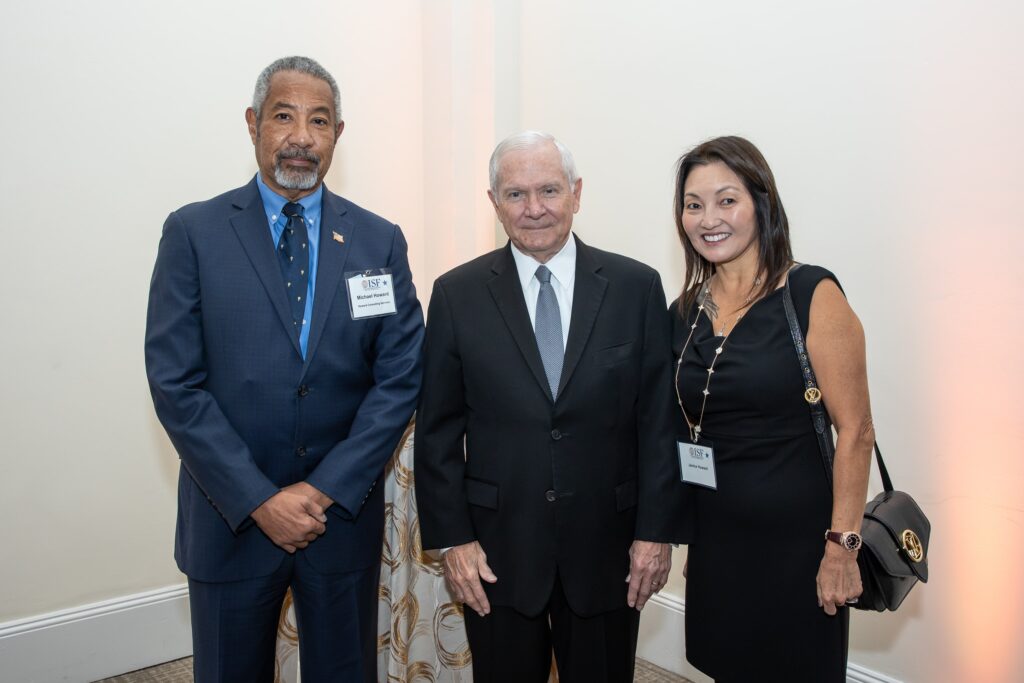 two men and a woman standing next to each other