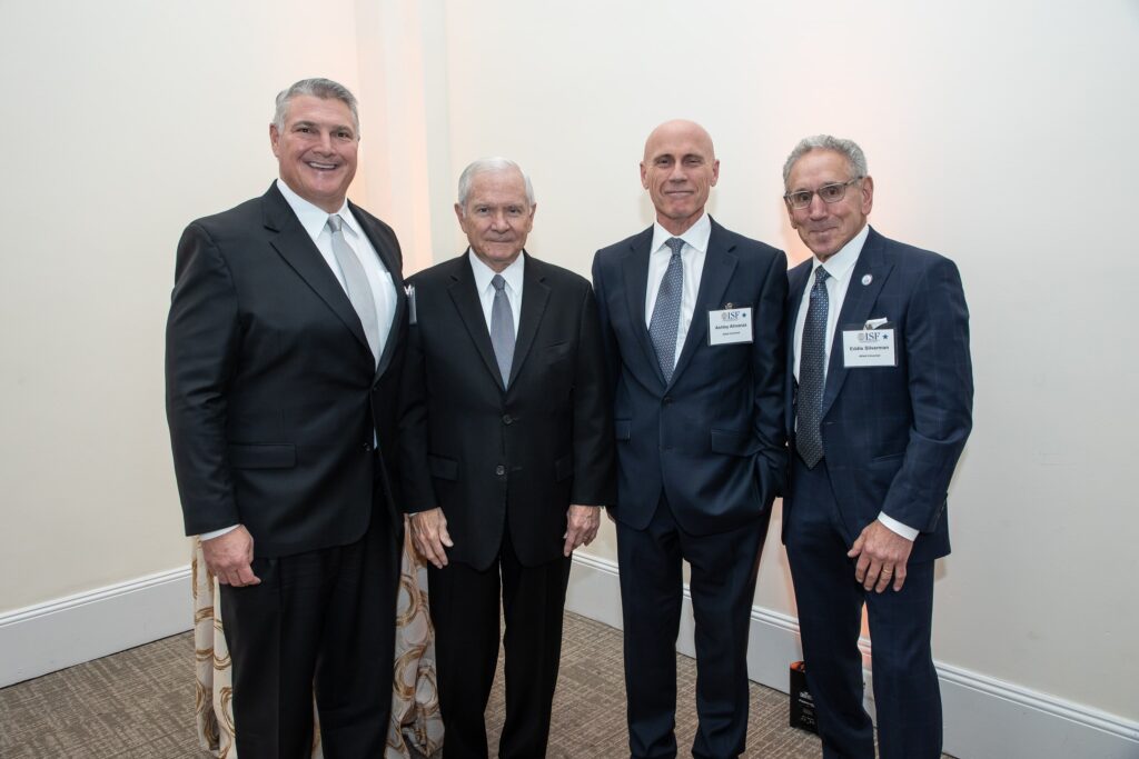 three men in suits and ties standing next to each other