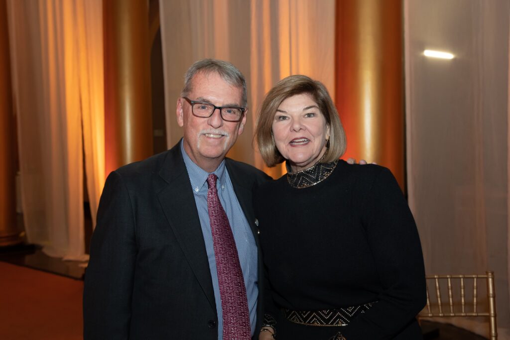 a man and woman standing next to each other