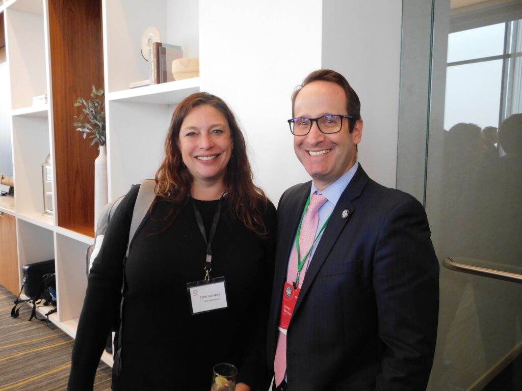 a man and woman standing next to each other