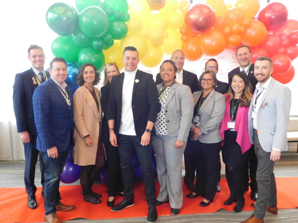 a group of people standing in front of balloons