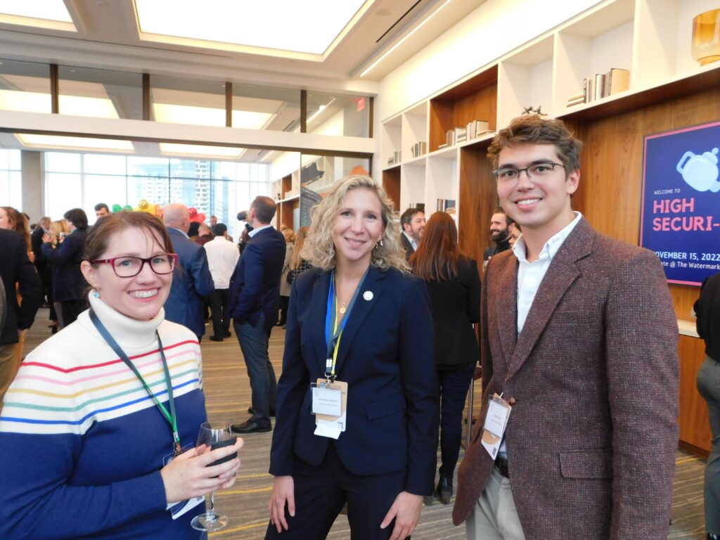 two women and a man are standing together