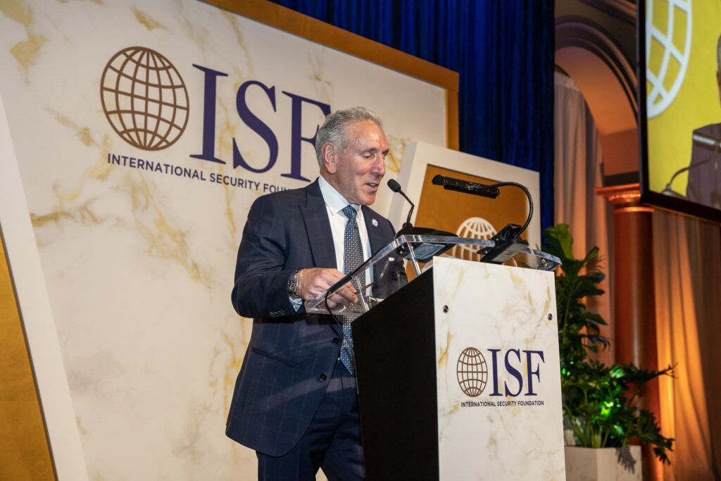 a man standing at a podium giving a speech