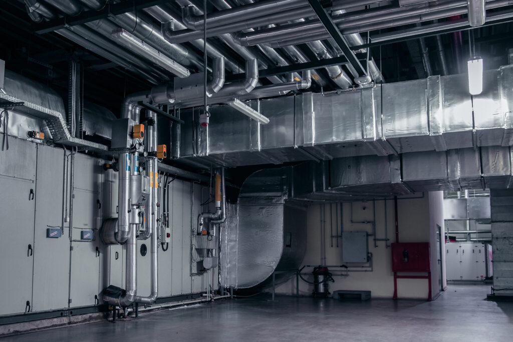 a large industrial building with a bunch of pipes