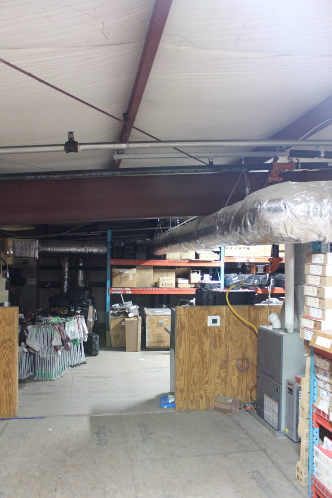 a room filled with lots of wooden boxes