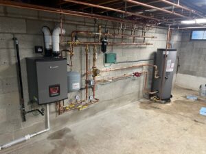 a large room with pipes and a water heater