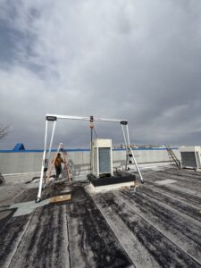a person on a roof with a ladder