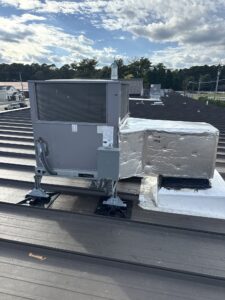 the roof of a commercial building with an air conditioner on top of it
