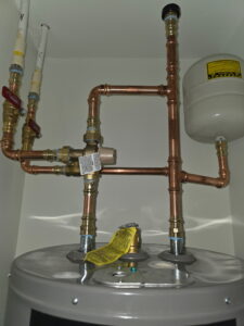 a water heater that is connected to a tank