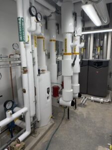 a large room with pipes and valves in it
