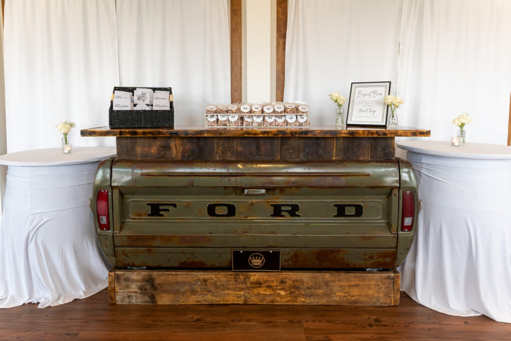 A party favor bar of dog treats to take home to your pups on the Ford Truck bar in the Sunporch of the Pole Barn at King Cole Farm.