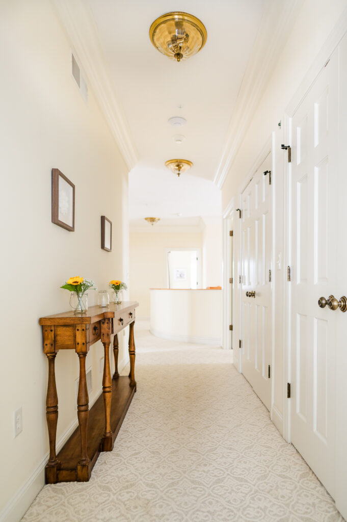 The upstairs hallway leading to the staircase in The Residence at King Cole Farm.