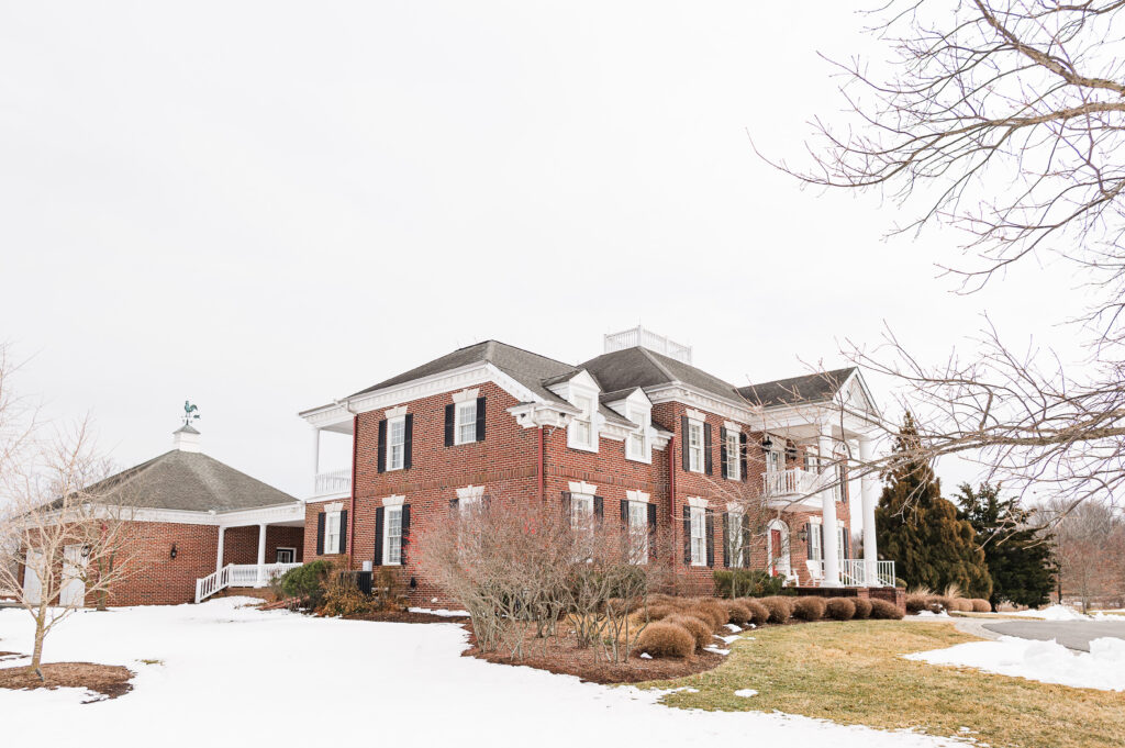 An image of The Residence and Garage at King Cole Farm with snow on the ground.