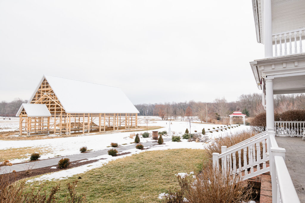 An image of the back patio of The Residence overlooking the ceremony sites - The Pavilion and The Gazebo.