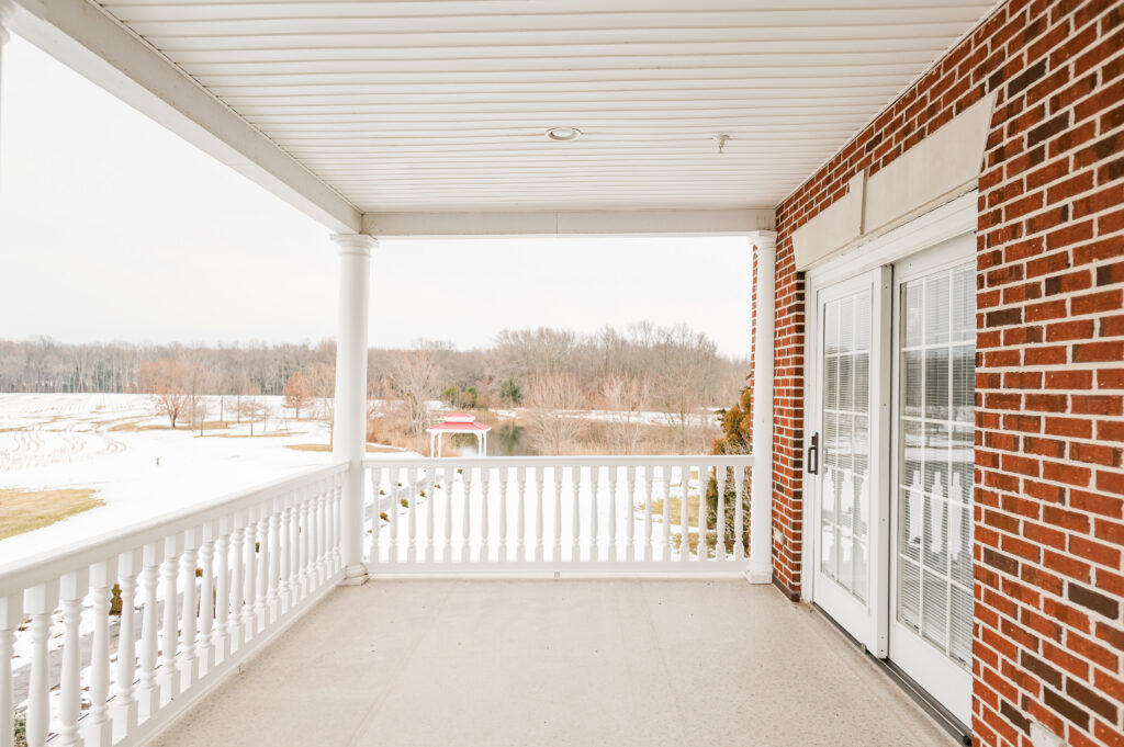Image of the balcony facing the ceremony site on the bridal suite bedroom balcony at King Cole Farm