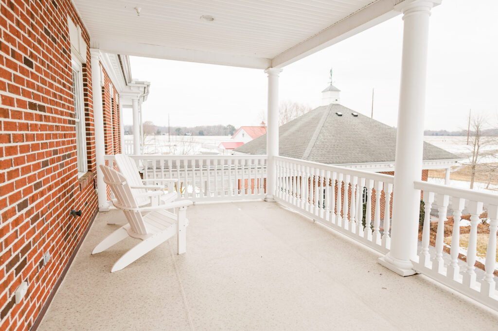 Image of the balcony facing the pole barn on the bridal suite bedroom balcony at King Cole Farm