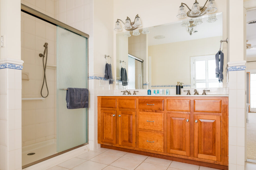 Image of a double vanity and shower in the bridal suite bathroom at King Cole Farm