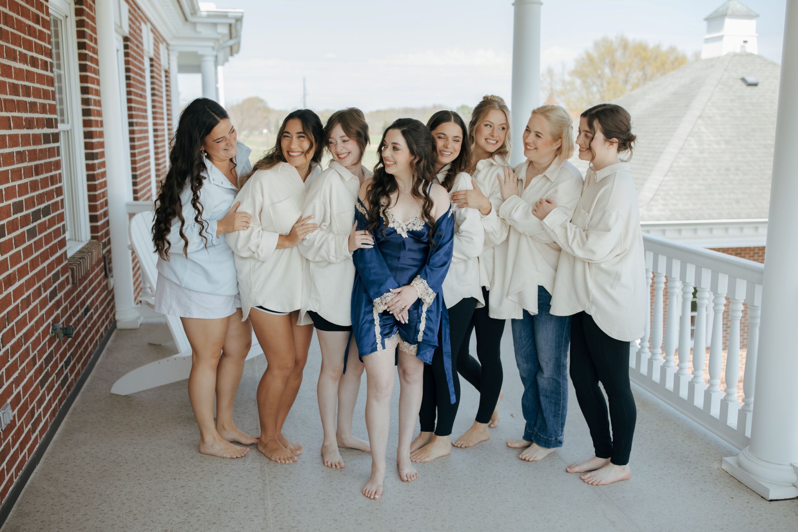 bride and bridal party on the balcony