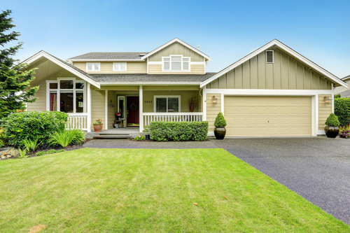 a large house with a driveway in front of it