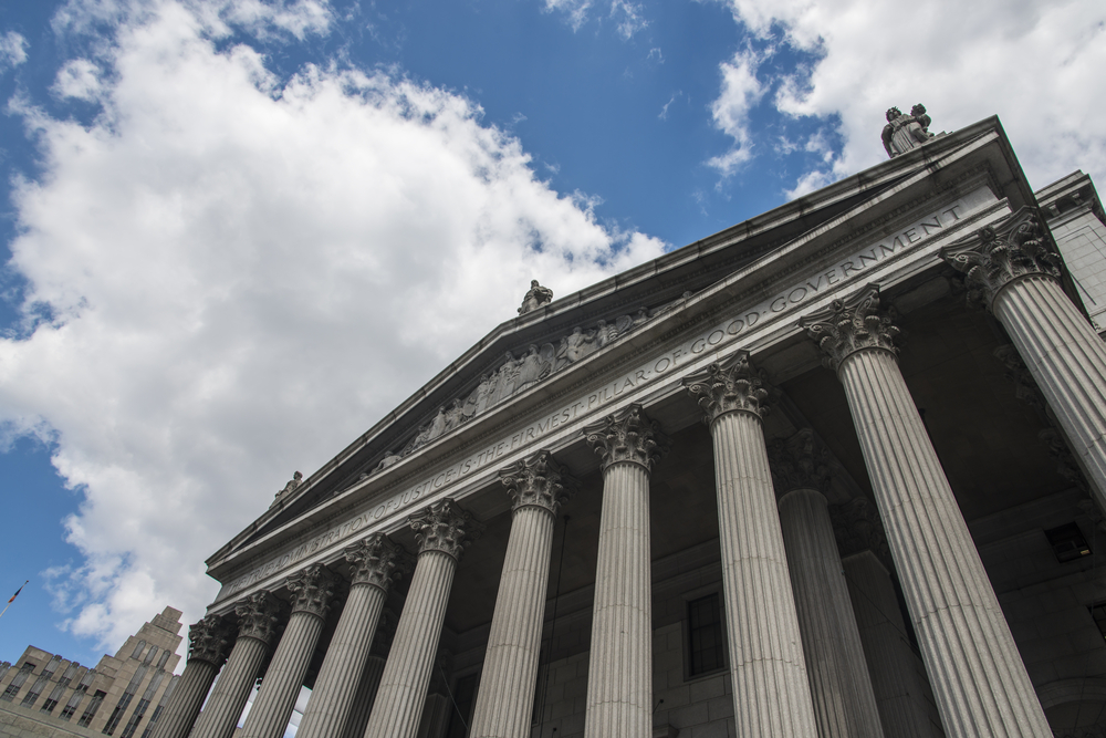 a tall building with many columns on top