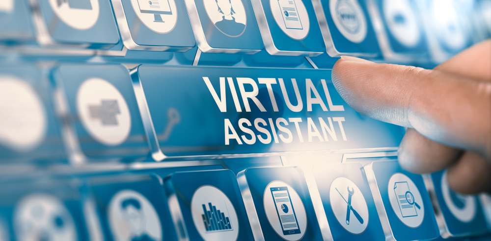 a hand pointing at a virtual assistant sign
