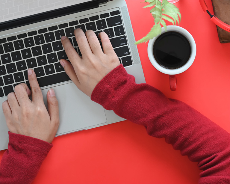 Get-a-quote a person typing on a laptop with their hands