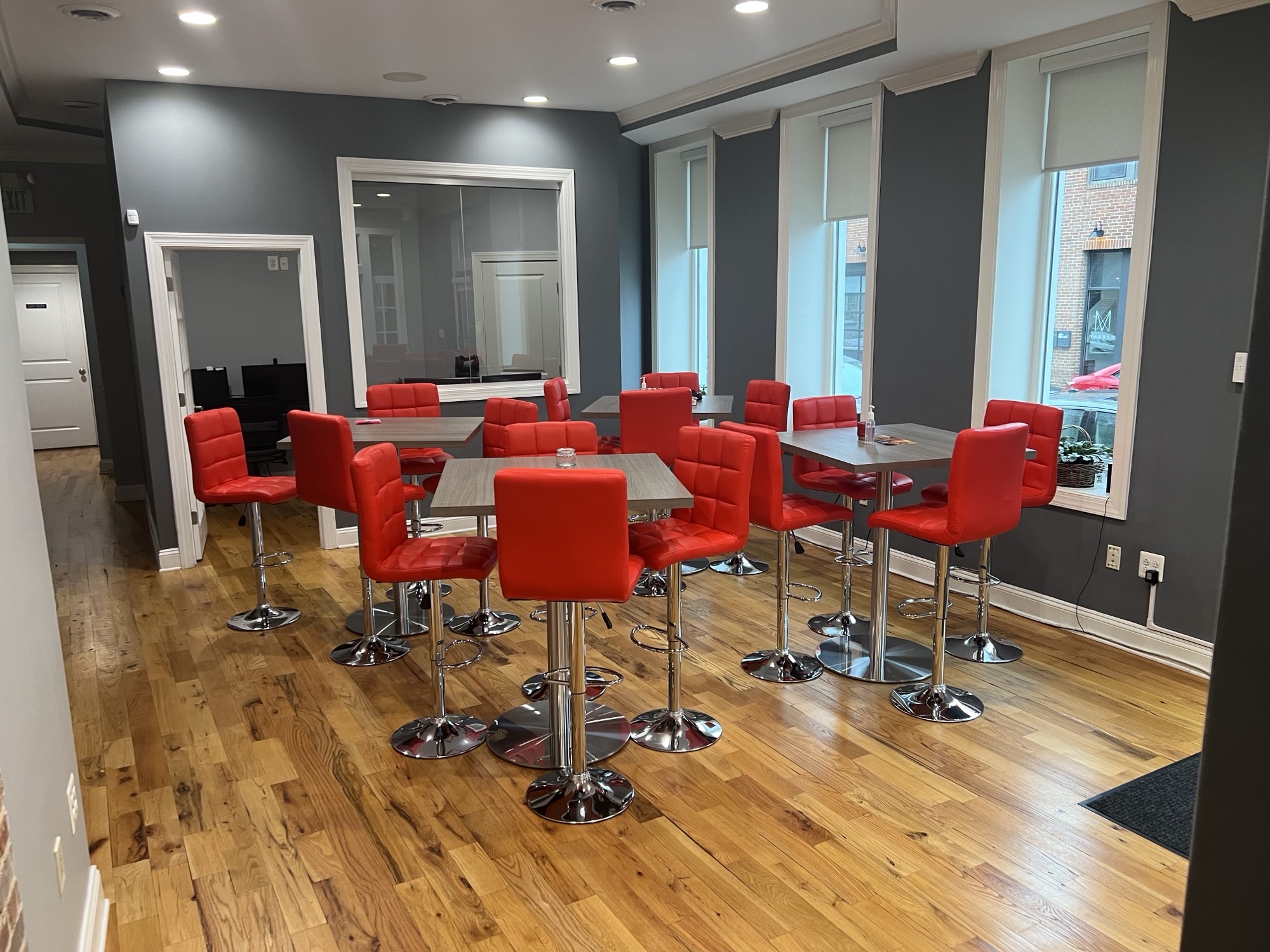 Picture of Baltimore office meeting space with tables and chairs in room.